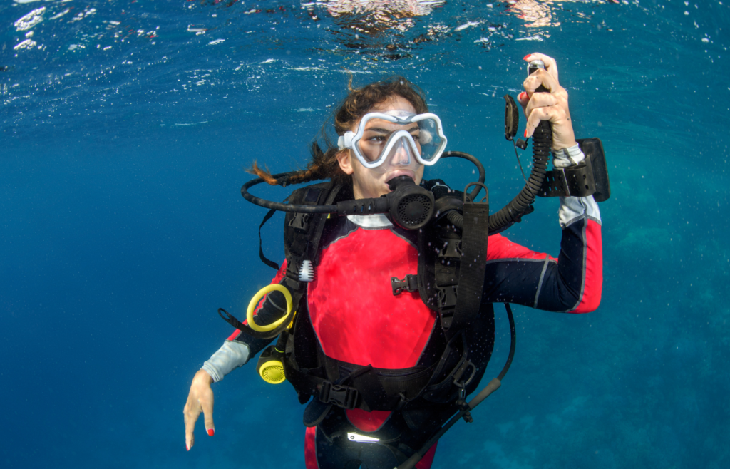 A scuba diver descending underwater